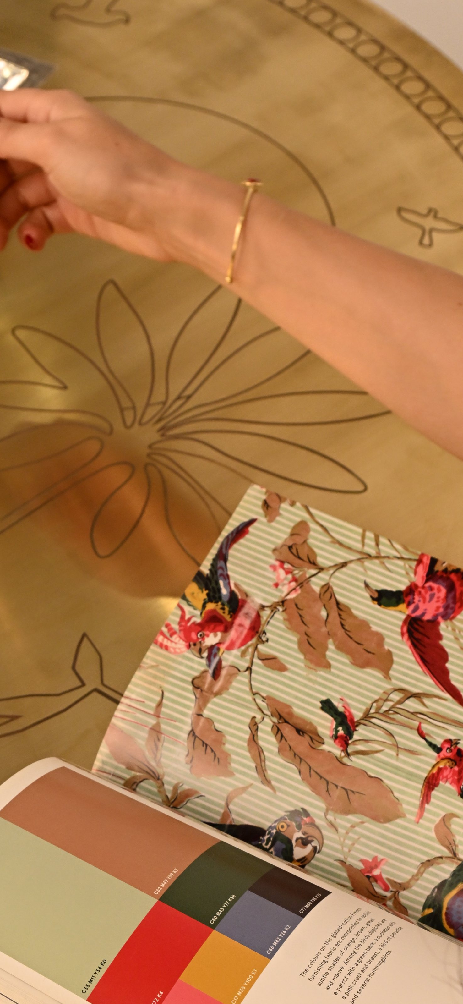 Alia at the Sun’s Grace table, leafing through a book of prints